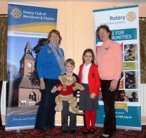 Winner of TBT draw Samuel Lanning and his sister Imogen with VP Linda and District AG Elaine